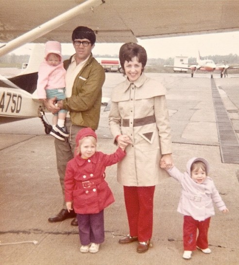 The Aurand family (from rigth: Julie, Genevieve, Jeanette, and Nelson holding cousin Kristen) with the family's four seat Cessna 170B (circa 1974)